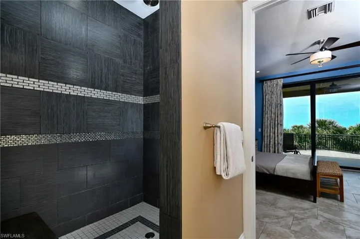 Washroom with cabinet space, baseboards, separate washer and dryer, and recessed lighting