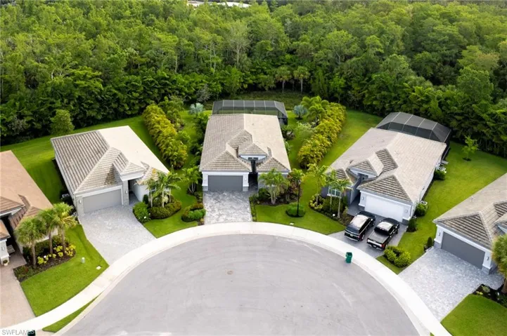 View of subject property with a heavily wooded area