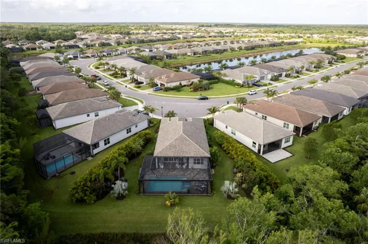 Aerial perspective of suburban area with a large body of water