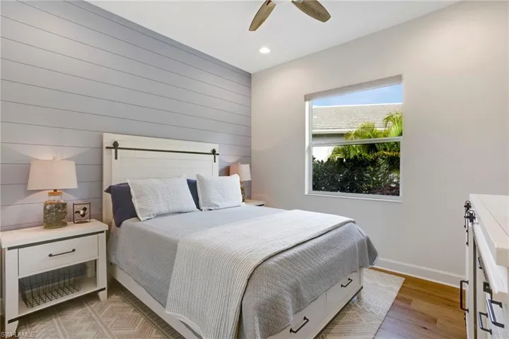 Bedroom featuring baseboards, recessed lighting, light wood-type flooring, and ceiling fan