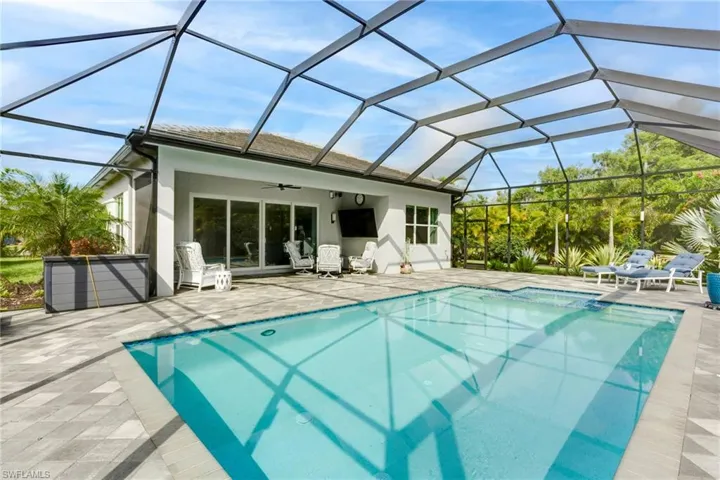 Swimming pool with a patio and ceiling fan