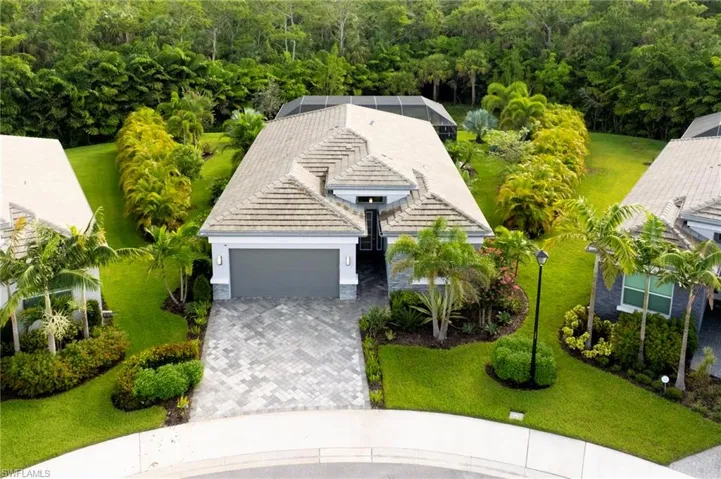 View from above of property with a heavily wooded area