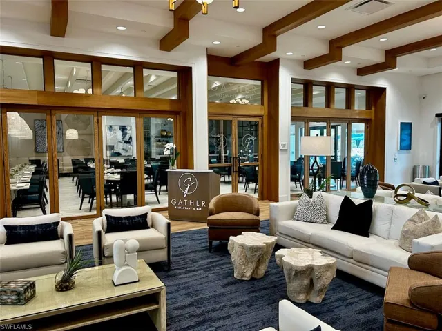 Living area with beamed ceiling and recessed lighting