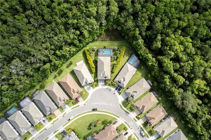 Aerial overview of property's location featuring nearby suburban area