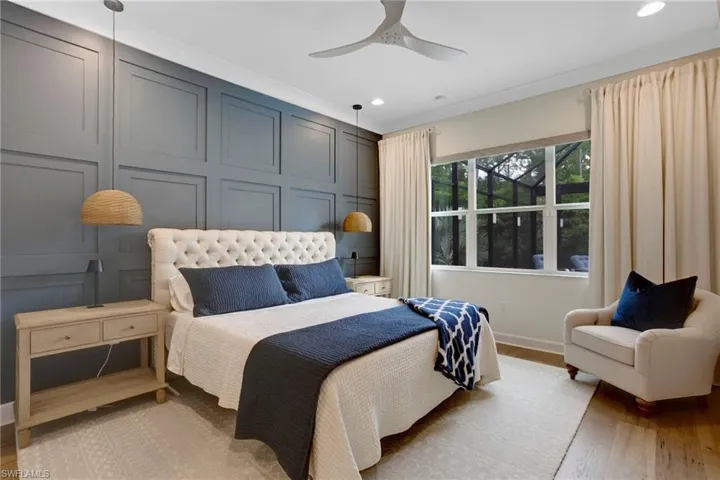 Bedroom featuring light wood finished floors, recessed lighting, ceiling fan, and baseboards