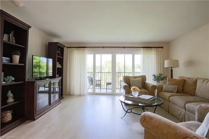 Living area with light wood-type flooring
