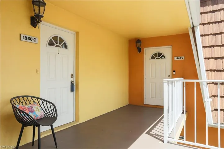 View of exterior entry with a porch