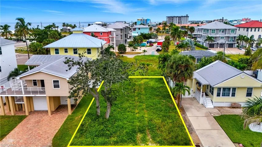 Aerial view of residential area with property boundaries highlighted - Virtually Edited Image