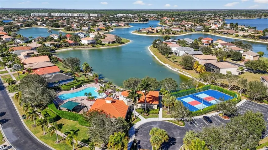 View of property location featuring a nearby body of water and nearby suburban area
