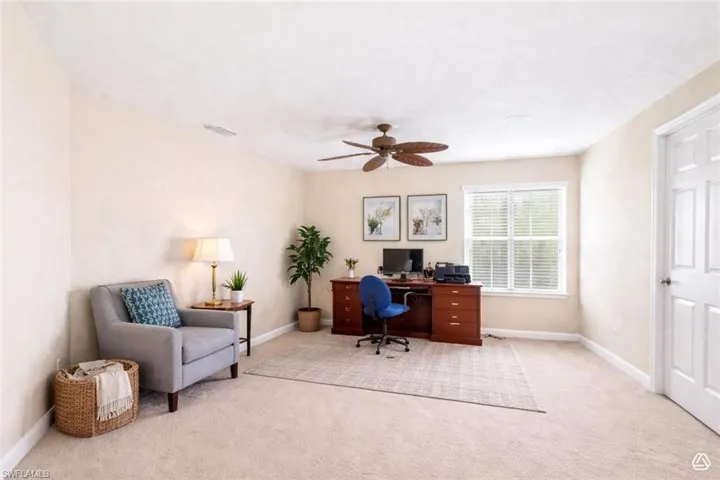 flex Room  featuring a ceiling fan, a window with blinds, and neutral wall tones