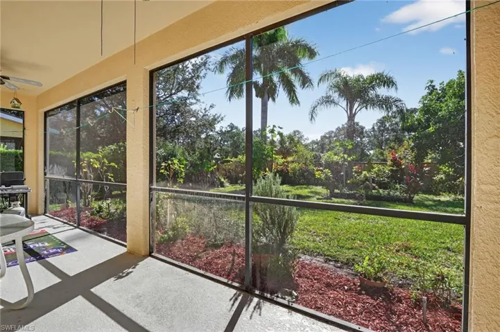 Unfurnished sunroom featuring ceiling fan