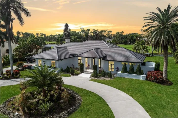 View of front of property with a lawn