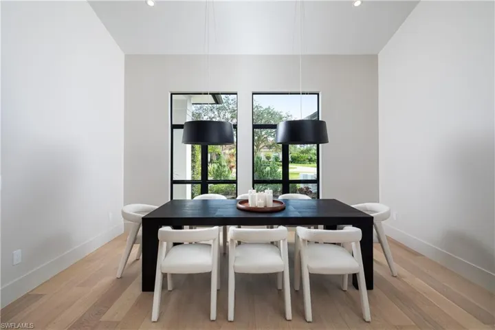 Dining area with light wood-type flooring