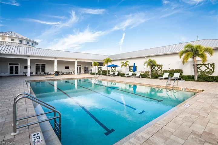 View of swimming pool featuring french doors and a patio area