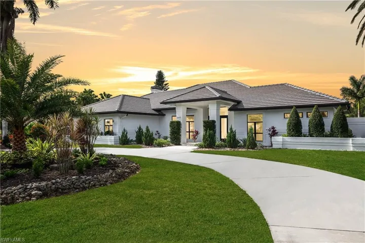 View of front of property with a yard