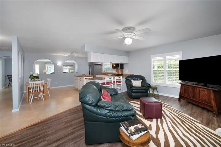 Living room with hardwood / wood-style flooring