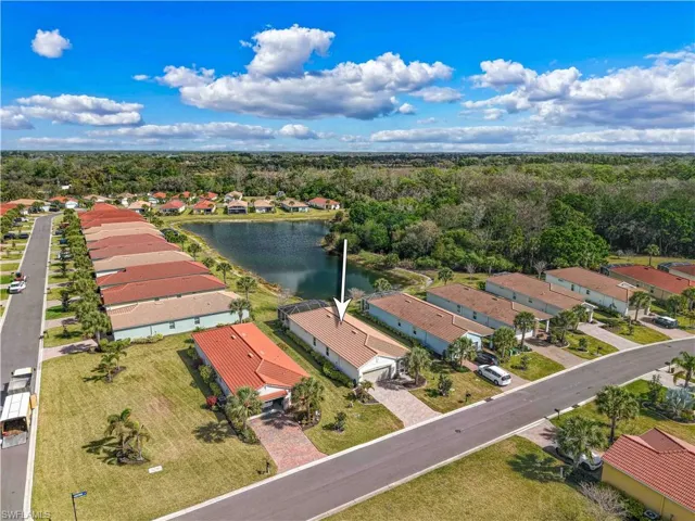 Aerial perspective of suburban area with a nearby body of water