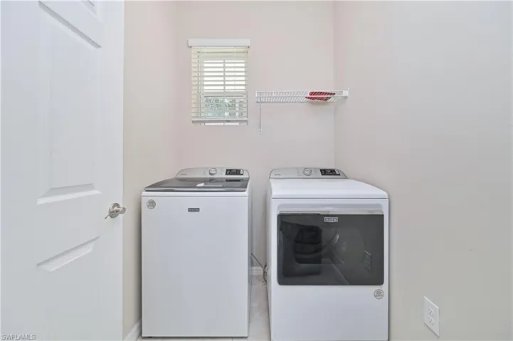 Laundry room featuring washer and clothes dryer