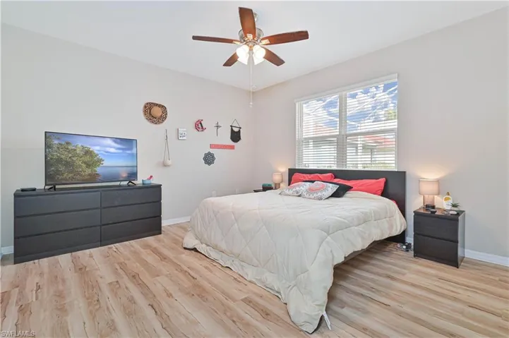 Bedroom featuring light wood finished floors and a ceiling fan