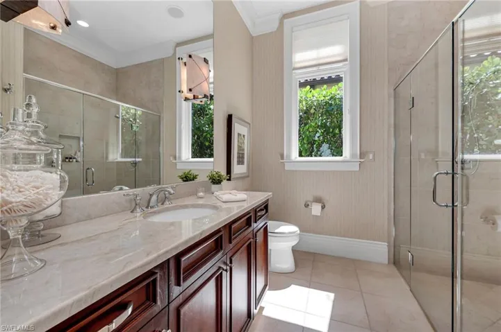 This residence has two primary baths, this one with a large, walk-in shower and a separate walk-in closet.