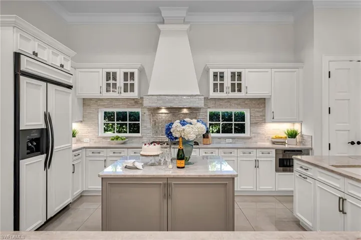The great room has custom built-ins for entertainment, with a new, Control 4 audio system installed throughout.