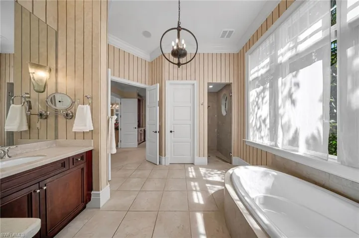 The second primary bath has large soaking tub and shower, with huge, walk-in closet.