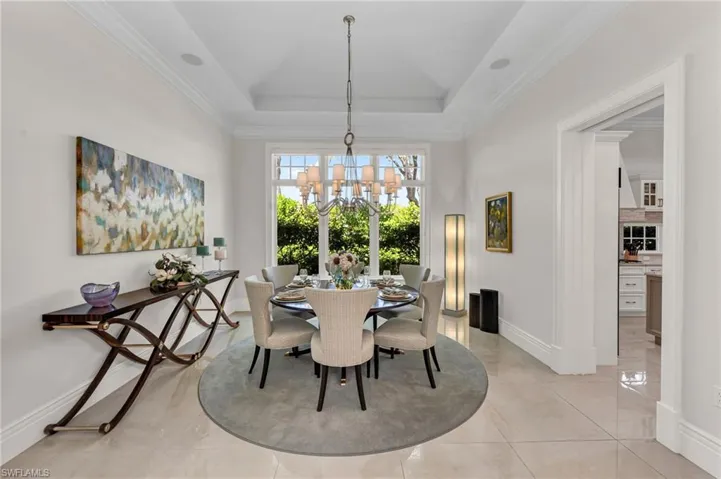 The dining room had columns removed and 30" x 30" porcelain tiles installed throughout main areas of the residence.
