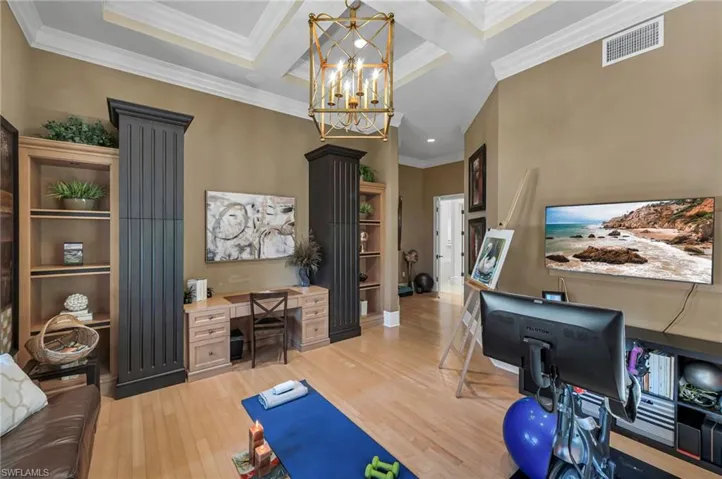Beautiful, coffered ceilings, bespoke cabinetry and a built-in desk makes this room a real treasure!
