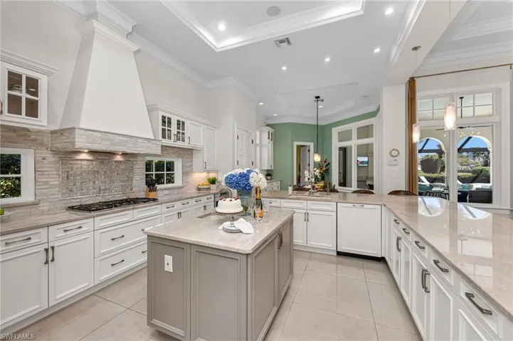 The details are apparent with inlaid, marble insert for backsplash and hood.