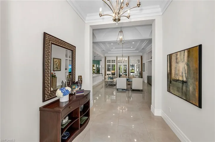 The foyer welcomes you to this incredible residence, with 30" x 30" porcelain tile that have replaced the original flooring.