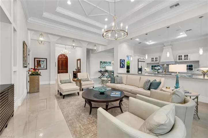 Columns and walls have been removed to open up this great room and expansive kitchen.