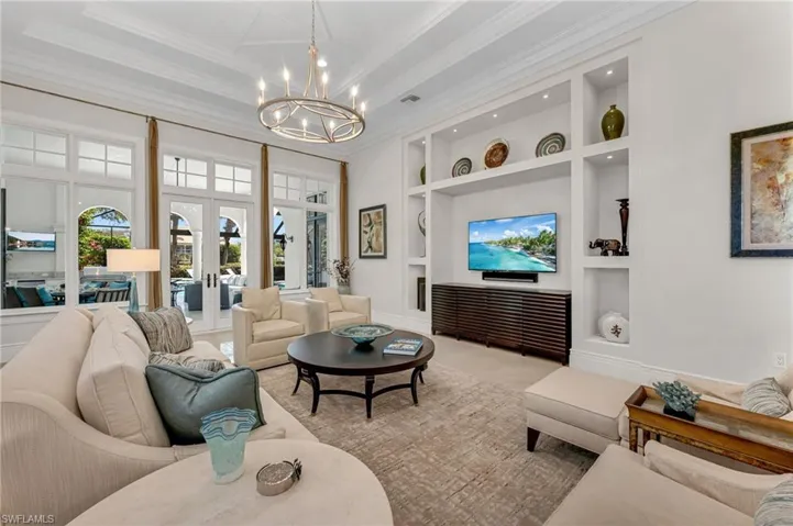 The great room has custom built-ins for entertainment, with a new, Control 4 audio system installed throughout.