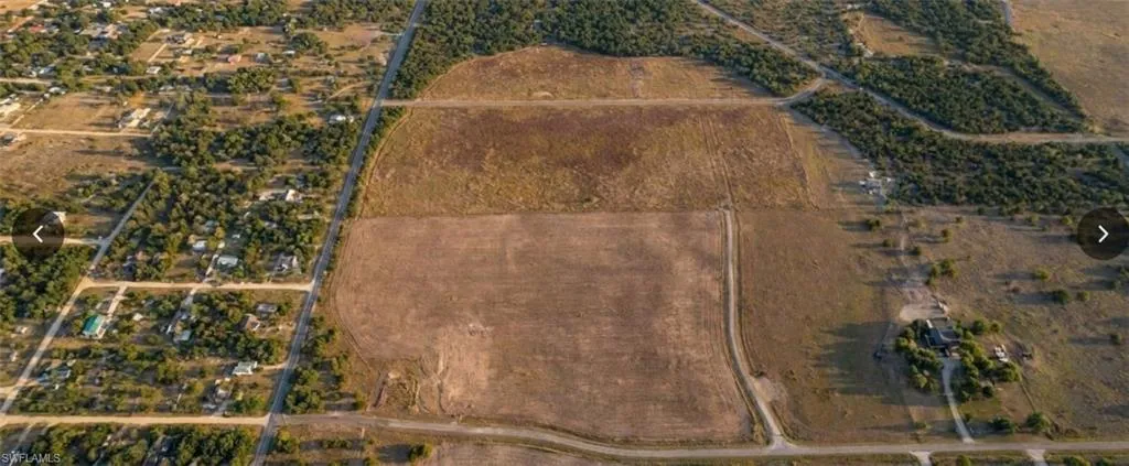 Expansive acreage featuring cleared land and natural tree lines