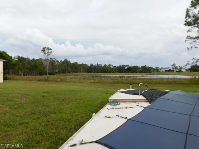 View of grassy yard featuring a water view