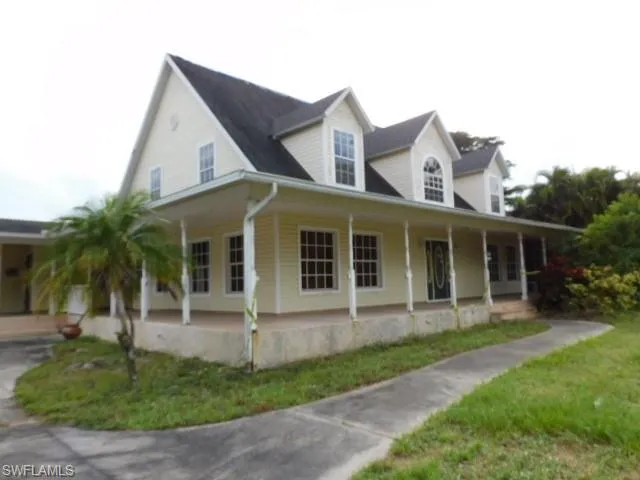 View of front of home featuring a large porch