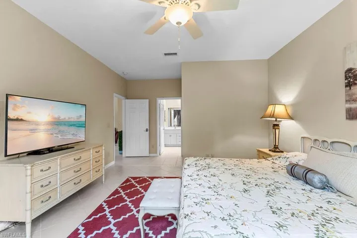 Recessed lighting, ceiling fan, tile flooring, and neutral wall tones