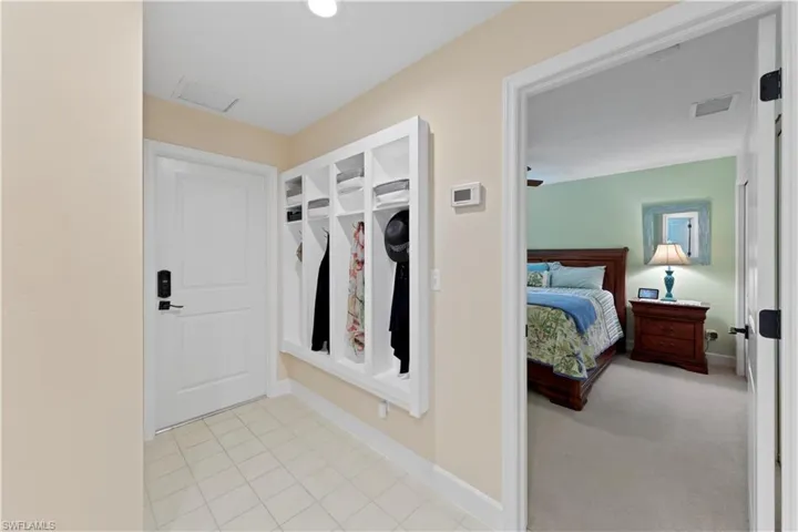 Garage entry featuring custom built in storage