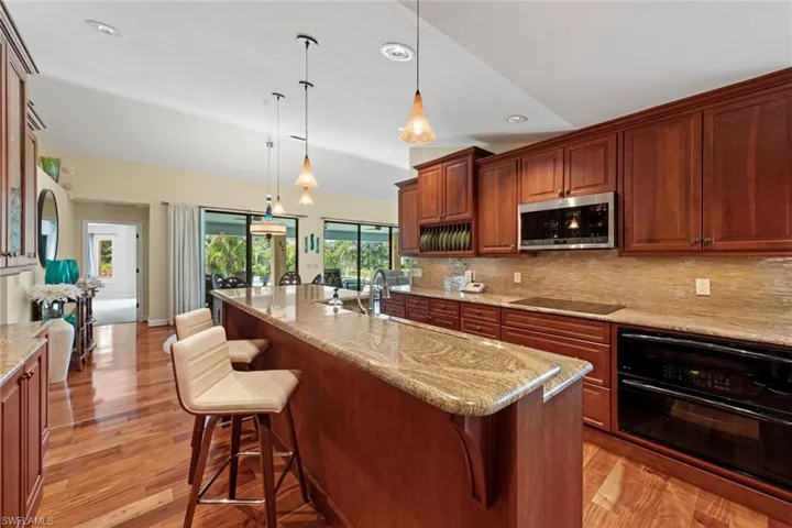 Updated kitchen with warm wood cabinetry