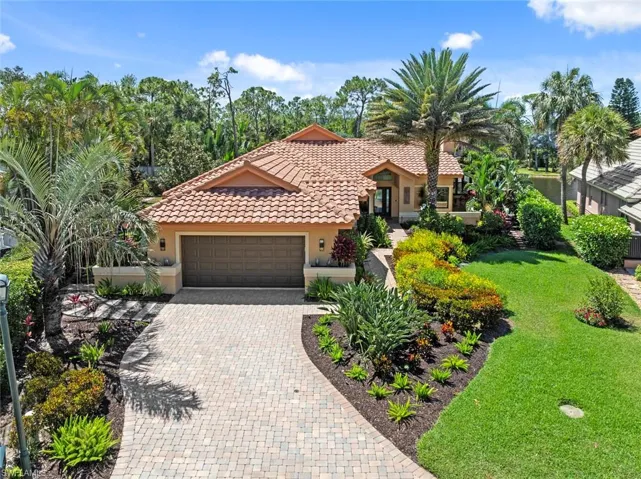 Long driveway leads to beautifully landscape walkway to entrance