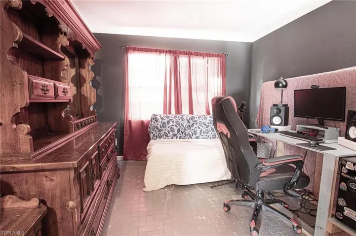 Office space with brick patterned flooring and crown molding
