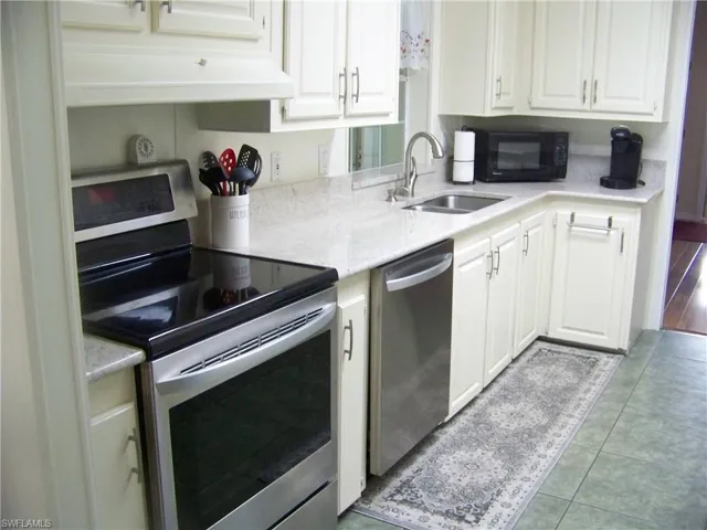 Stainless looks good here with white granite