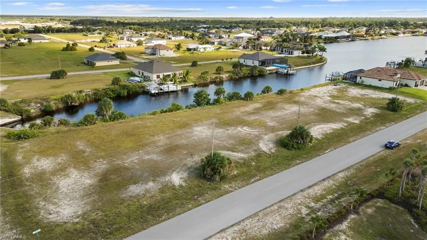 Aerial perspective of suburban area with a large body of water