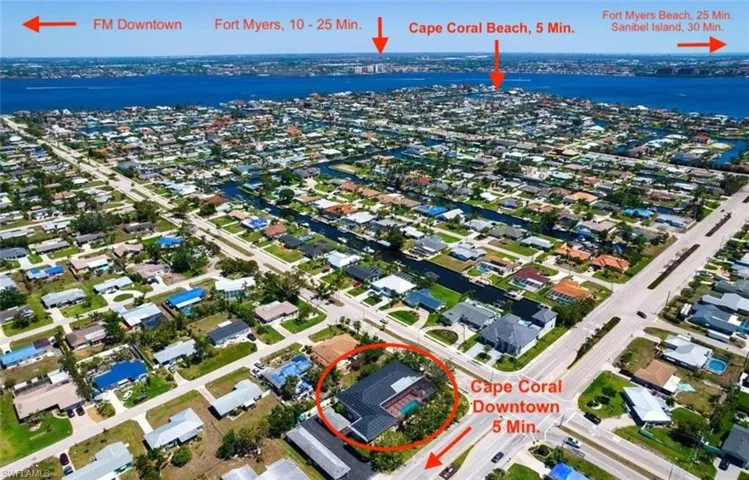 Aerial view of residential area featuring a large body of water