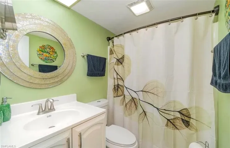 Full bath featuring vanity and a shower with shower curtain