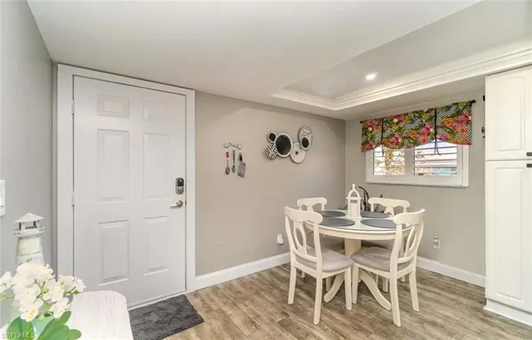 Dining space featuring baseboards and light wood-type flooring