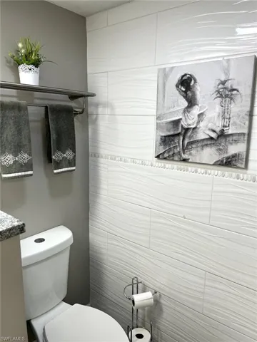 Half bathroom featuring toilet and vanity
