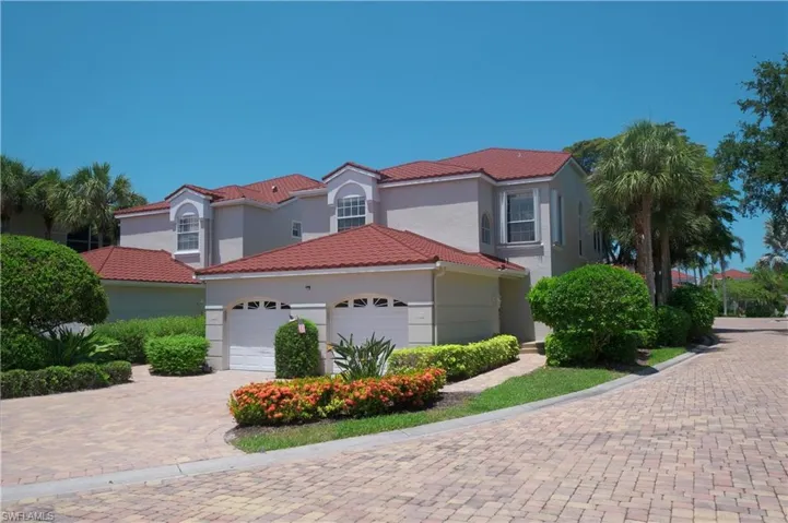 Mediterranean / spanish home with a garage