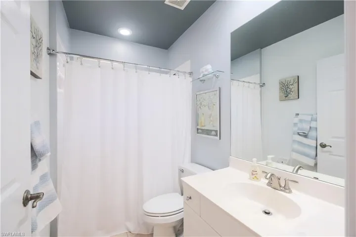 Bathroom featuring vanity and toilet