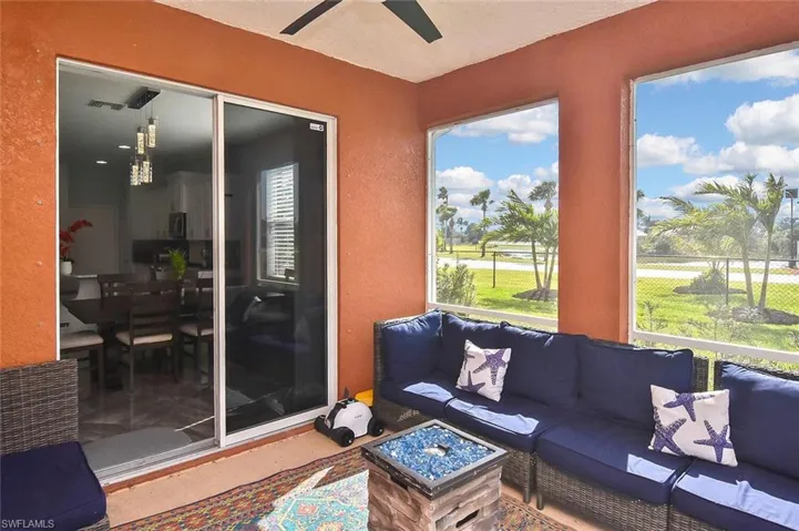 Sliders off of the dining room lead to a relaxing under-truss outdoor space...