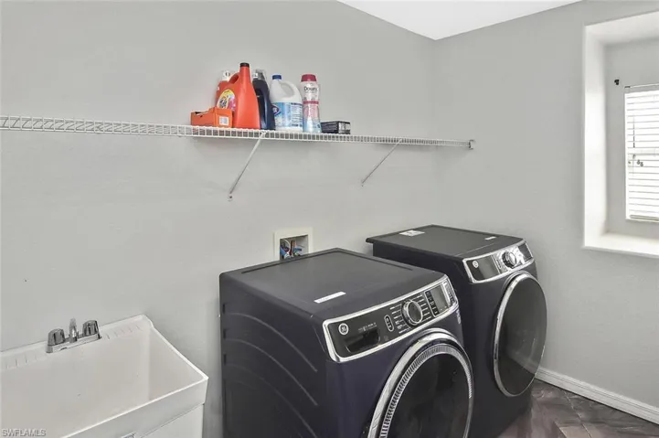 Laundry room with utility sink.
